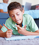 Boy working on his math