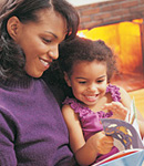 Mom reading to daughter