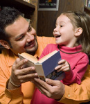 Dad and daughter reading